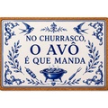 Azulejo trivet on cork reading No churrasco, o avô é que manda, with swallows, a barbecue grill, a skewer and a fork.